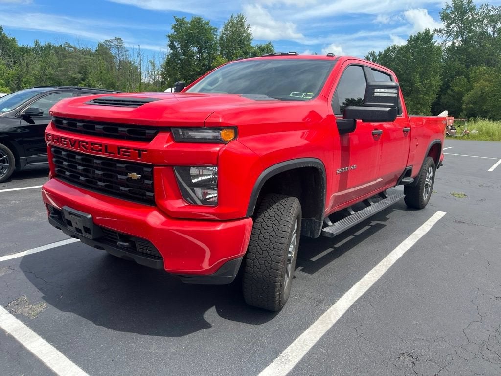 2022 Chevrolet Silverado 2500 HD Custom in Red Hot — front three-quarter view