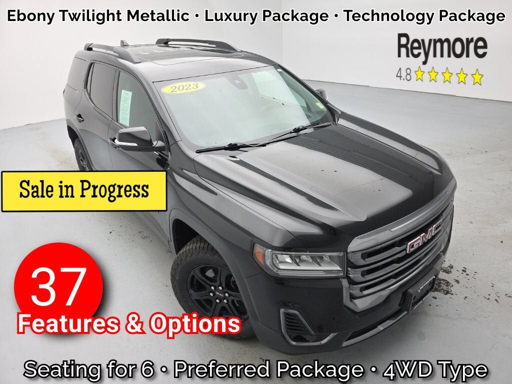 2023 GMC Acadia AT4 in Ebony Twilight Metallic — front three-quarter view